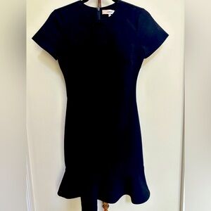 Black Likely short sleeve dress with ruffle hem. Size 0. excellent condition.